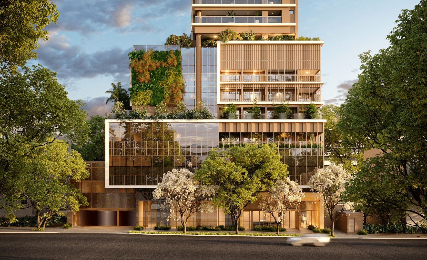 Edifício com fachada em alumínio, grandes vãos envidraçados e jardins verticais